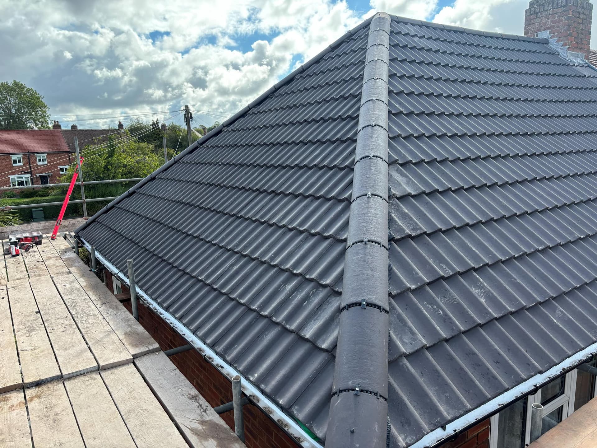 New Roof in Ashby de la Zouch with a Sandtoft Charcoal Double Pantile — roofing work by Armour Shield Roofing Services Coalville (photo 1)